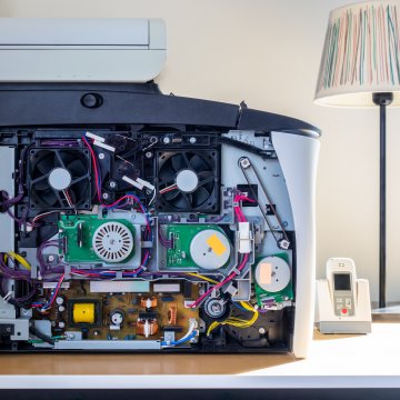 side view of a broken fax machine